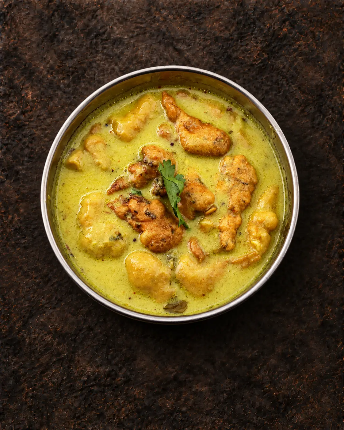 Butter Masala curry with tender pieces in a steel bowl